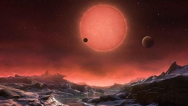 Recreación de la estrella Trappist-1, vista desde uno de los tres planetas que la orbitan