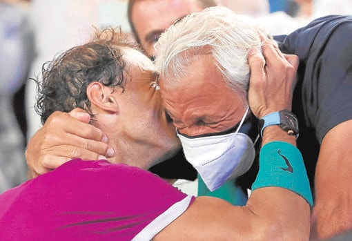 Nadal hugs his father Sebastian