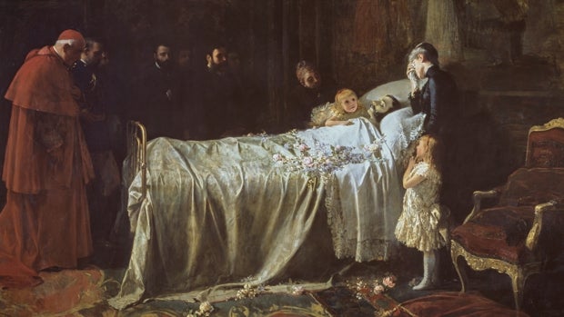 Alfonso XII yace sobre su cama, en el Palacio de El Pardo, rodeado por la Reina María Cristina y sus dos hijas, la Princesa de Asturias y la Infanta María Teresa, obra de Benlliure y Gil
