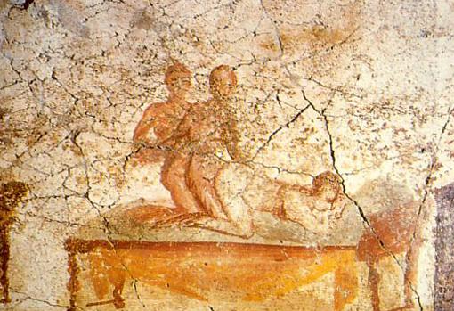 Dos hombres y una mujer en un fresco de Pompeya.