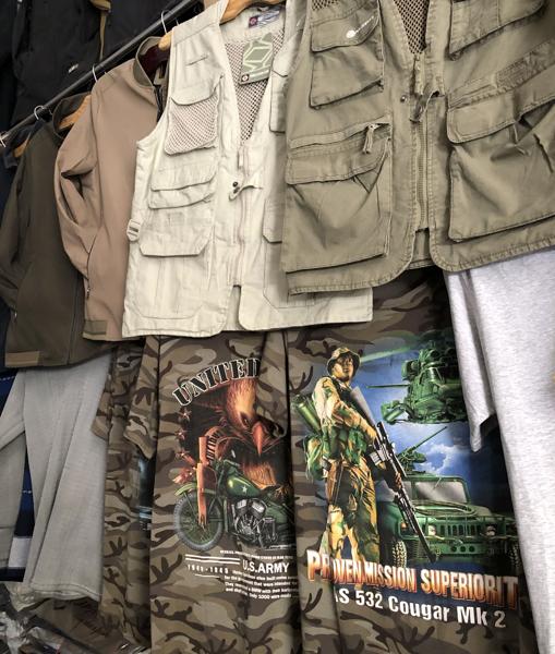 A stall with t-shirts in the market known as 'Bush Market'