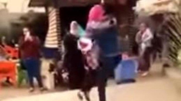 showed a young man carrying a bouquet of flowers kneeling before a young woman and then hugging her in what appeared to be a marriage proposal
